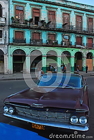 Vintage Chevrolet car of Cuba in front of old building in Havana