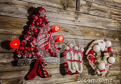 Vintage christmas decoration: red, white things on wooden backgr