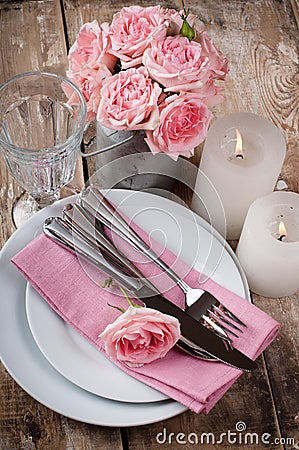 Vintage festive table setting with pink roses