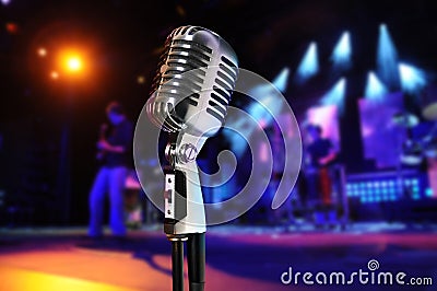Vintage Microphone With Concert in Background
