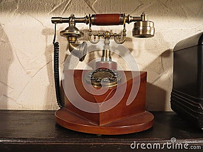 Vintage old style wooden phone with retro disc dial