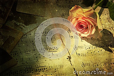 Vintage picture of a pink rose with music notes
