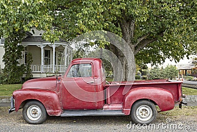 Vintage Red Truck in Front of Victorian Home
