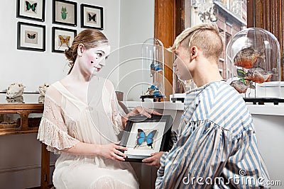 Vintage sailor and 18th century make-up girl in victorian dress