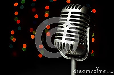 Vintage silver microphone on a colored background