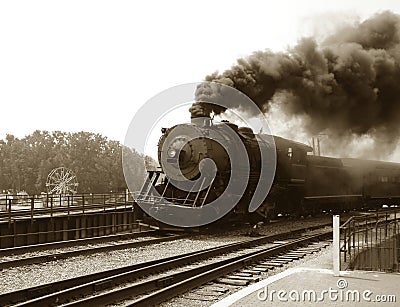 Vintage Steam Engine Locomotive and Train Speeding