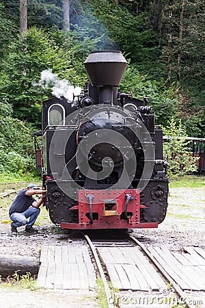 Vintage steam train locomotive being repaired