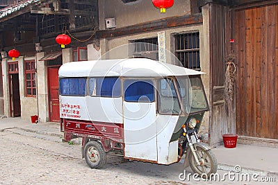Antique tuk tuk taxi in the old town Daxu in China