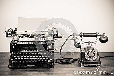 Vintage typewriter and telephone