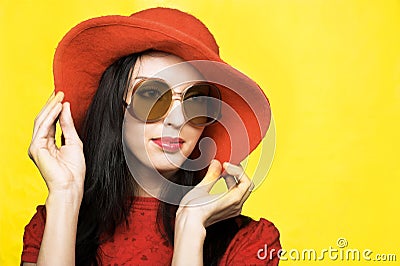 Vintage woman in sunglasses and red hat