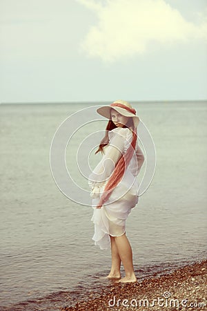 Vintage young lady by the sea