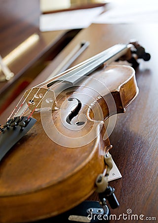 Violin on piano, back light