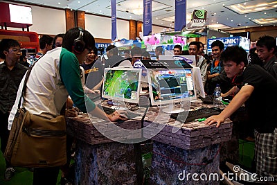 Visitors Playing Video Games at Indo Game Show 2013