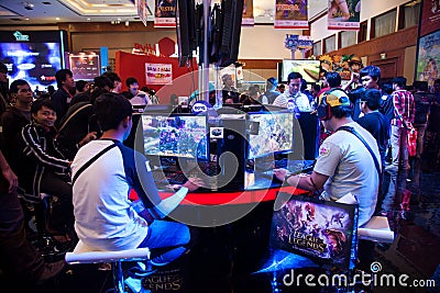 Visitors Playing Video Games at Indo Game Show 2013
