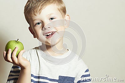 Vitamin.Smiling Child with apple.Little Boy with green apple.Health food. Fruits