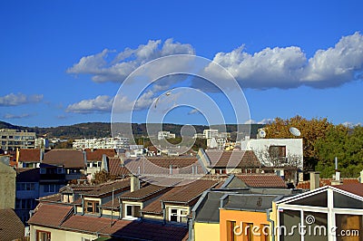 Vivid view over the town roofs and bright sky