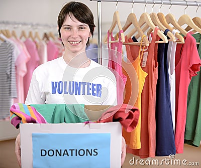 Volunteer with clothes donation box