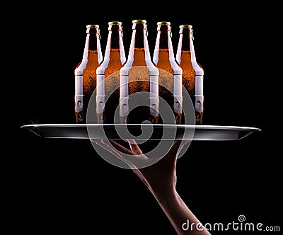 Waiter hand and tray with Beer