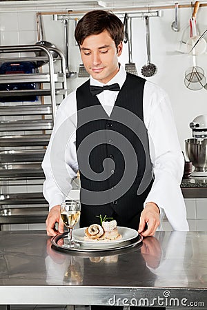 Waiter With Salmon Roll And White Wine