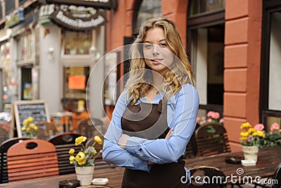 Waitress in front of restaurant