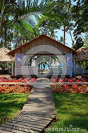 Walkway to restaurant in tropical garden