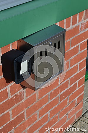 Wall mounted cigarette bin.