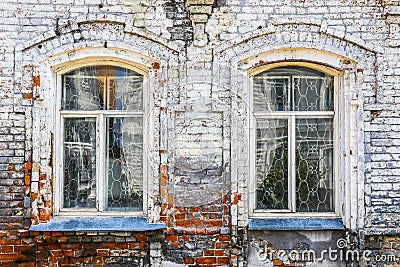 Wall of old brick house with windows