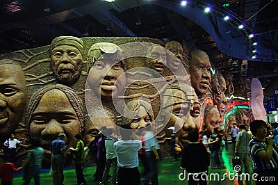 Wall of smiling faces in the Joint Africa Pavilion