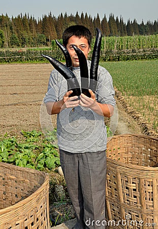 Wan Jia, China: Man with Eggplants