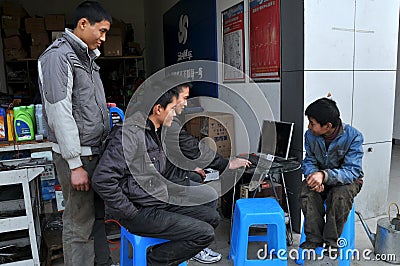 Wan Jia, China: Workers Using Computer
