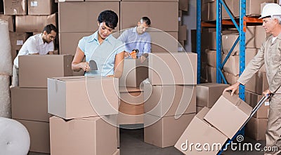 Warehouse workers preparing a shipment