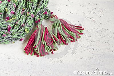 Warm winter scarf with colored pompoms