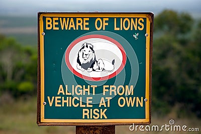 Warning sign on a fence of a South African game park