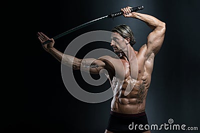 Warrior With Long Sword Over Black Background