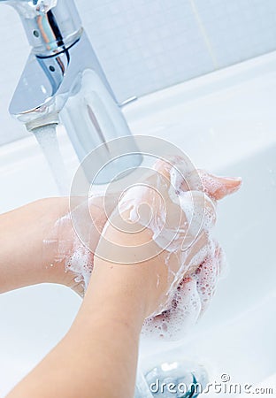 Washing of hands with soap