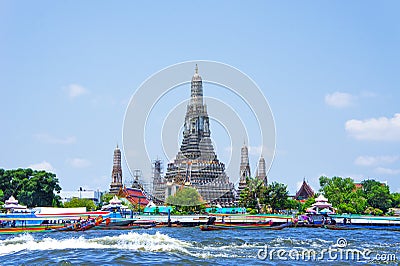 Wat Arun and long tail motor boat cruise on river in Bangkok