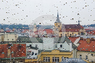 Water drop at the window with city background