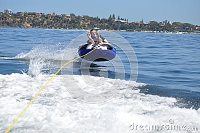 River water tubing skiing teen boy