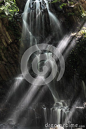 Waterfall with sun rays