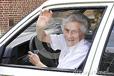 Waving senior woman