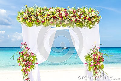 Wedding arch and set up on beach, tropical outdoor wedding