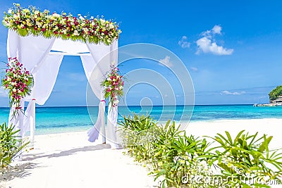 Wedding arch and set up on beach, tropical outdoor wedding