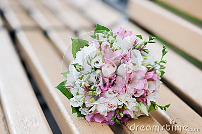 Wedding bouquet on banch. White and pink flowers