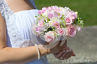 Wedding bouquet in hands of bride