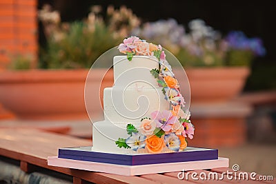 Wedding cake decorated with sugar flowers