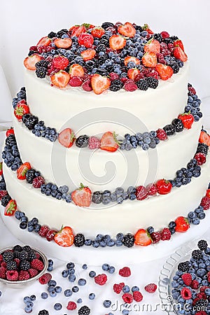 Wedding cake with fruits on white background
