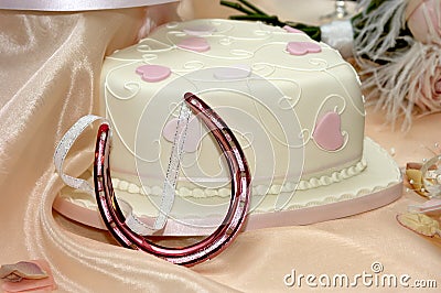 Wedding cake and horse shoe charm