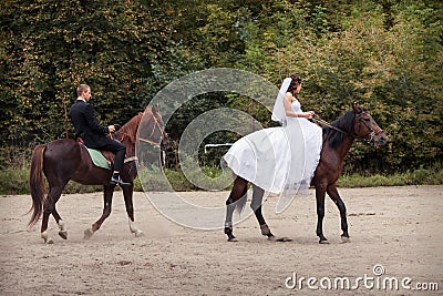 Wedding couple on horses