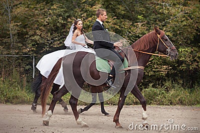 Wedding couple on horses