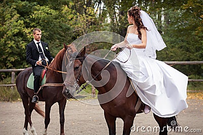 Wedding couple on horses